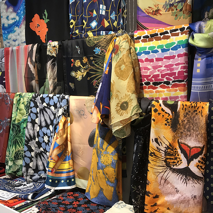 gouda showroom wall of scarf samples